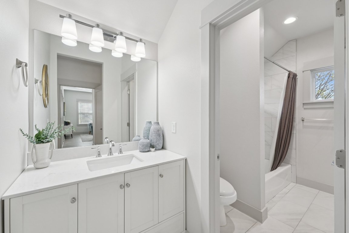 3711 Cedar Street Austin, TX 78705 - Photo 26 of 40 a bathroom with a double vanity sink and mirror