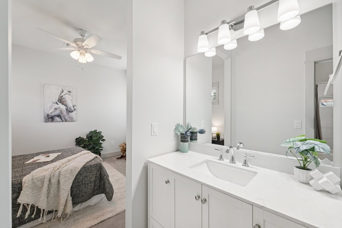 3711 Cedar Street Austin, TX 78705 - Photo 29 of 40 a bathroom with a sink vanity and a mirror