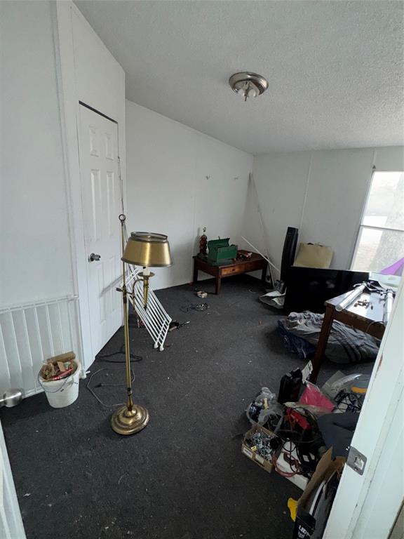 2525 Shiloh Road, Unit 240 Tyler, TX 75703 - Photo 4 of 18 a living room with furniture and gym equipment