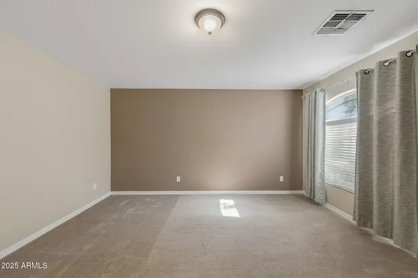 a view of an empty room and window