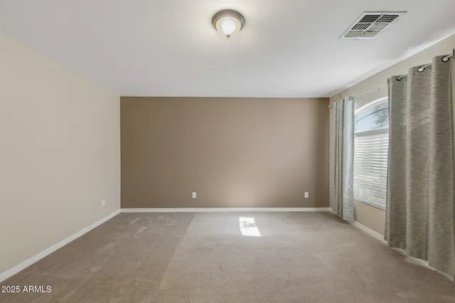 a view of an empty room and window