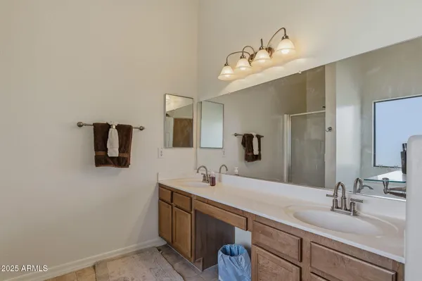 a view of walk in closet with clothes