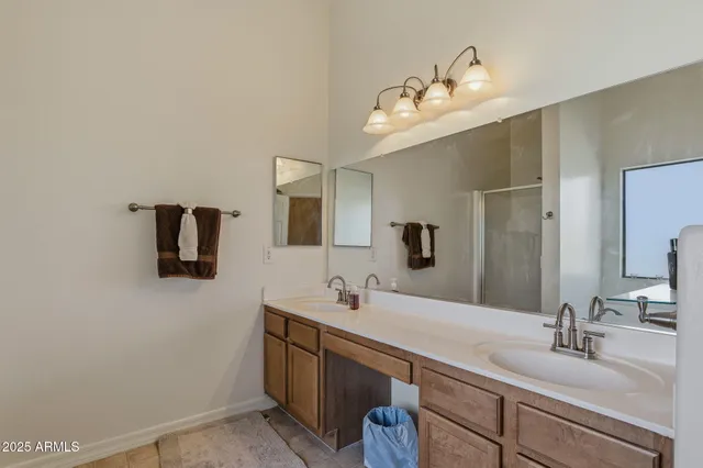 a view of walk in closet with clothes
