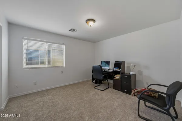 a bathroom with a double vanity sink toilet and a mirror