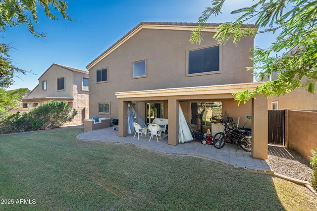 an aerial view of a house with a yard