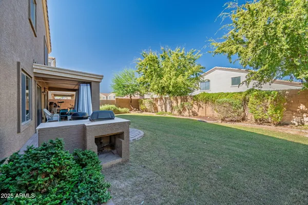 an aerial view of house with yard