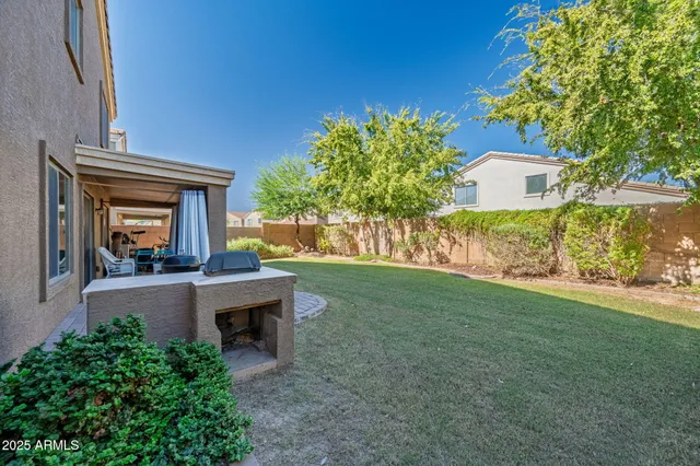 an aerial view of house with yard