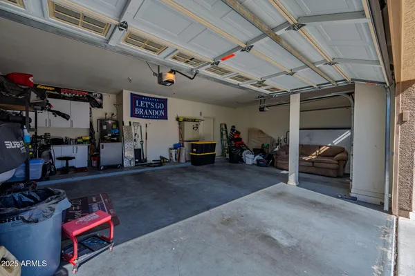 a front view of a house with a yard and a garage