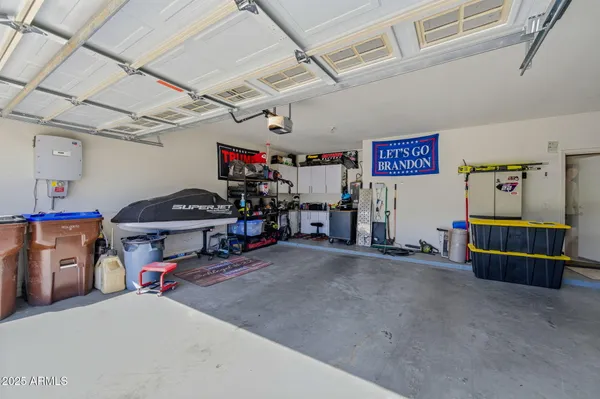 a view of a house with a yard and potted plants