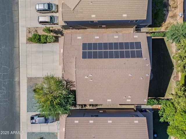 a view of a house with a backyard and a garden