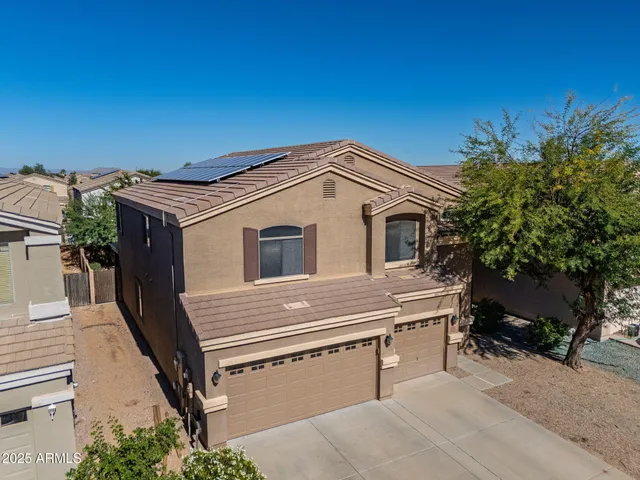 an aerial view of a city with parking