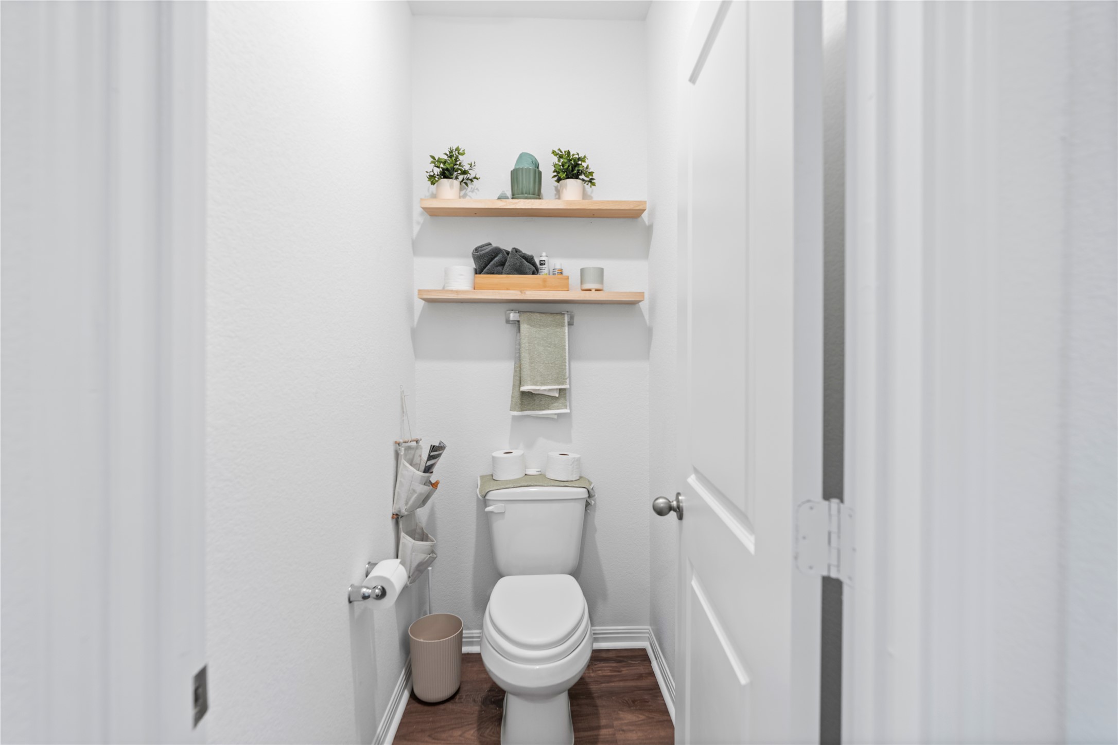 143 Santa Rosa Lane Buda, TX 78610 - Photo 5 of 28 Bathroom featuring wood finished floors and toilet