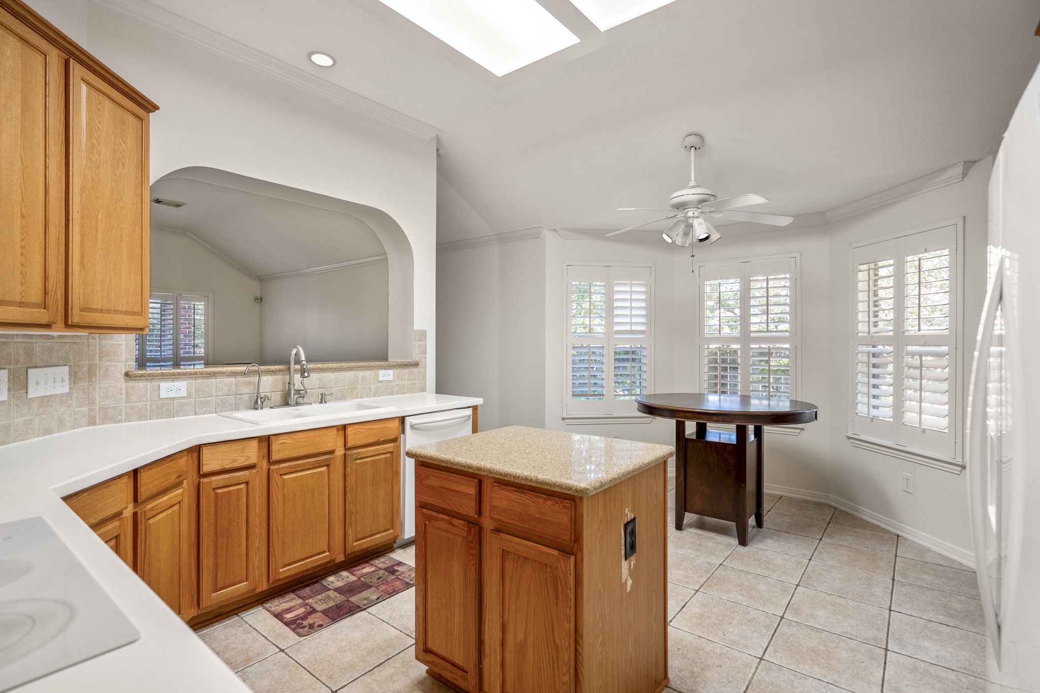 15 Heron Hollow Court Spring, TX 77382 - Photo 11 of 42 a kitchen with a sink a counter top space and appliances