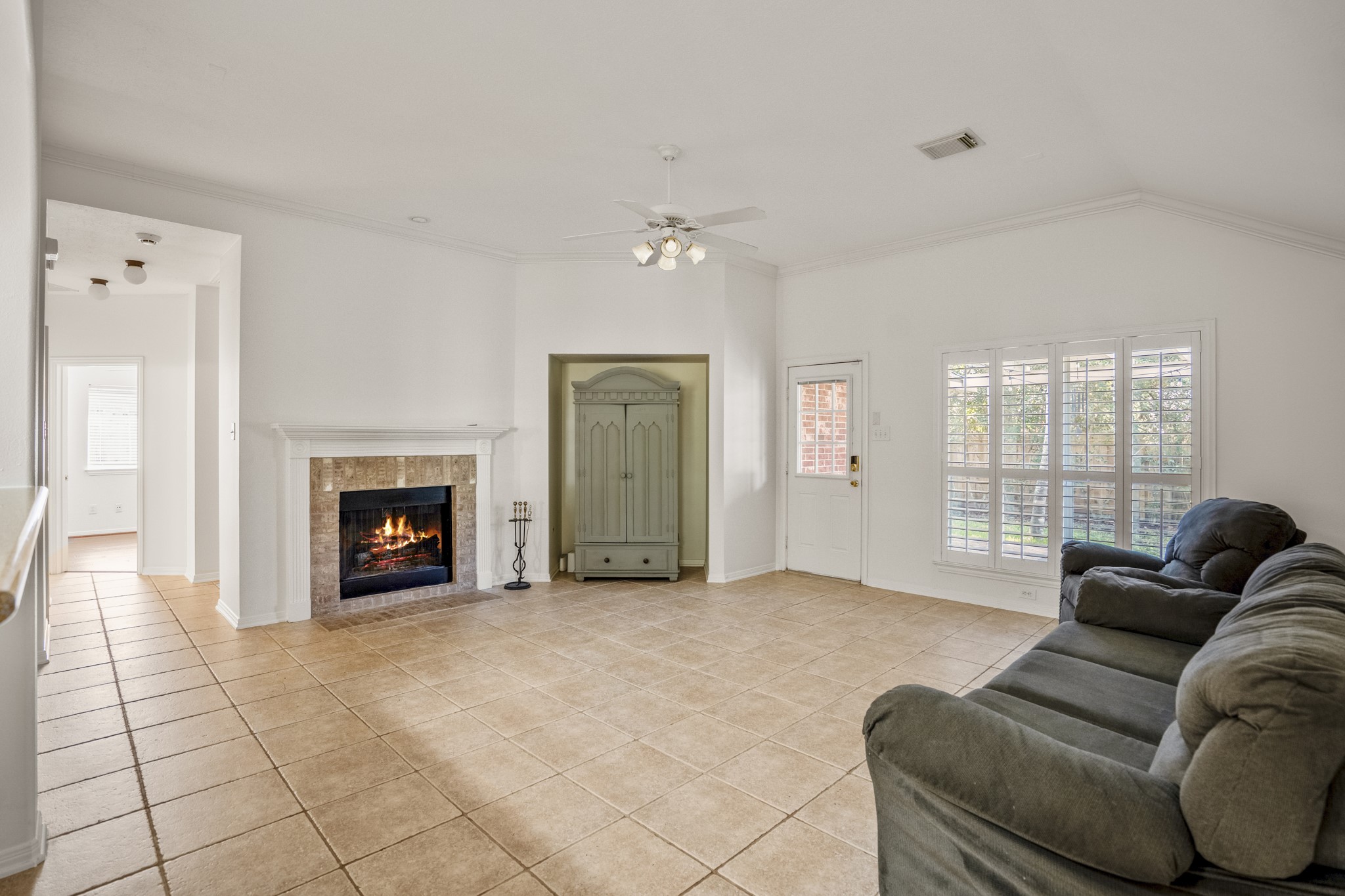 15 Heron Hollow Court Spring, TX 77382 - Photo 17 of 42 a living room with furniture and a fireplace