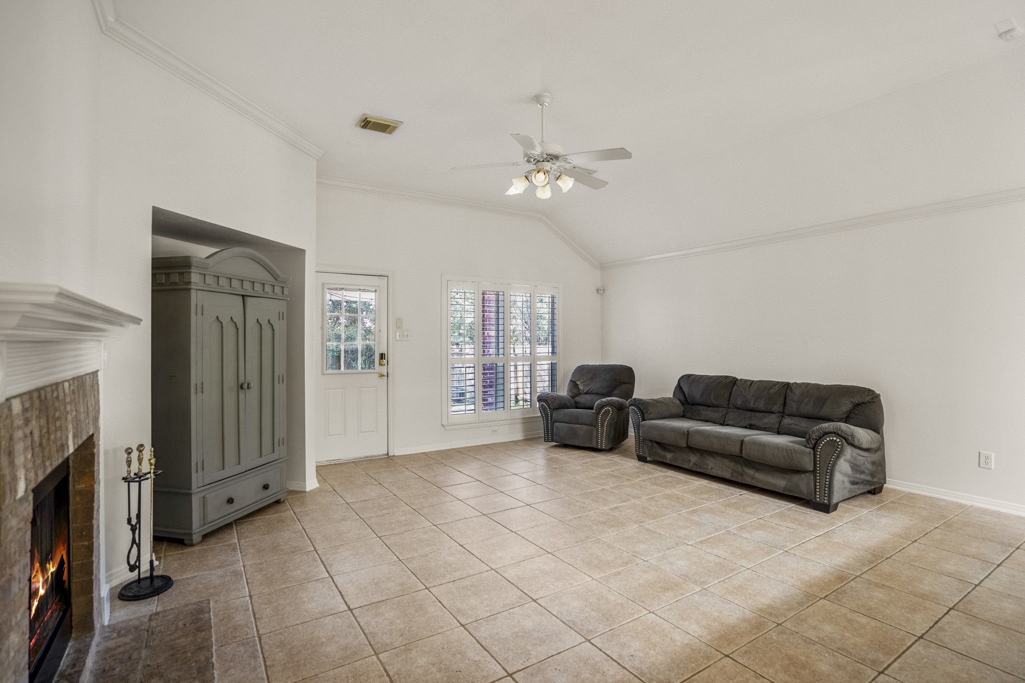 15 Heron Hollow Court Spring, TX 77382 - Photo 20 of 42 a living room with furniture and a flat screen tv