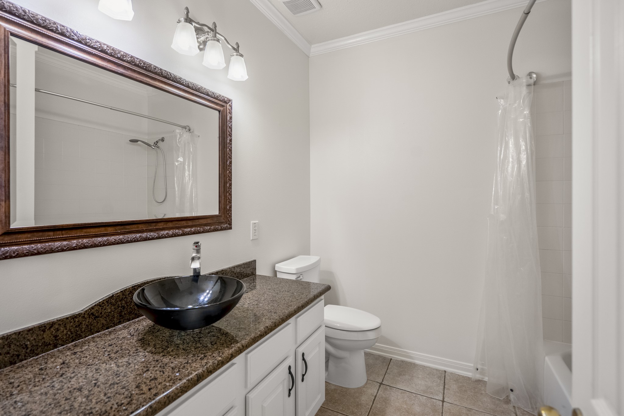 15 Heron Hollow Court Spring, TX 77382 - Photo 22 of 42 a bathroom with a granite countertop sink and a mirror
