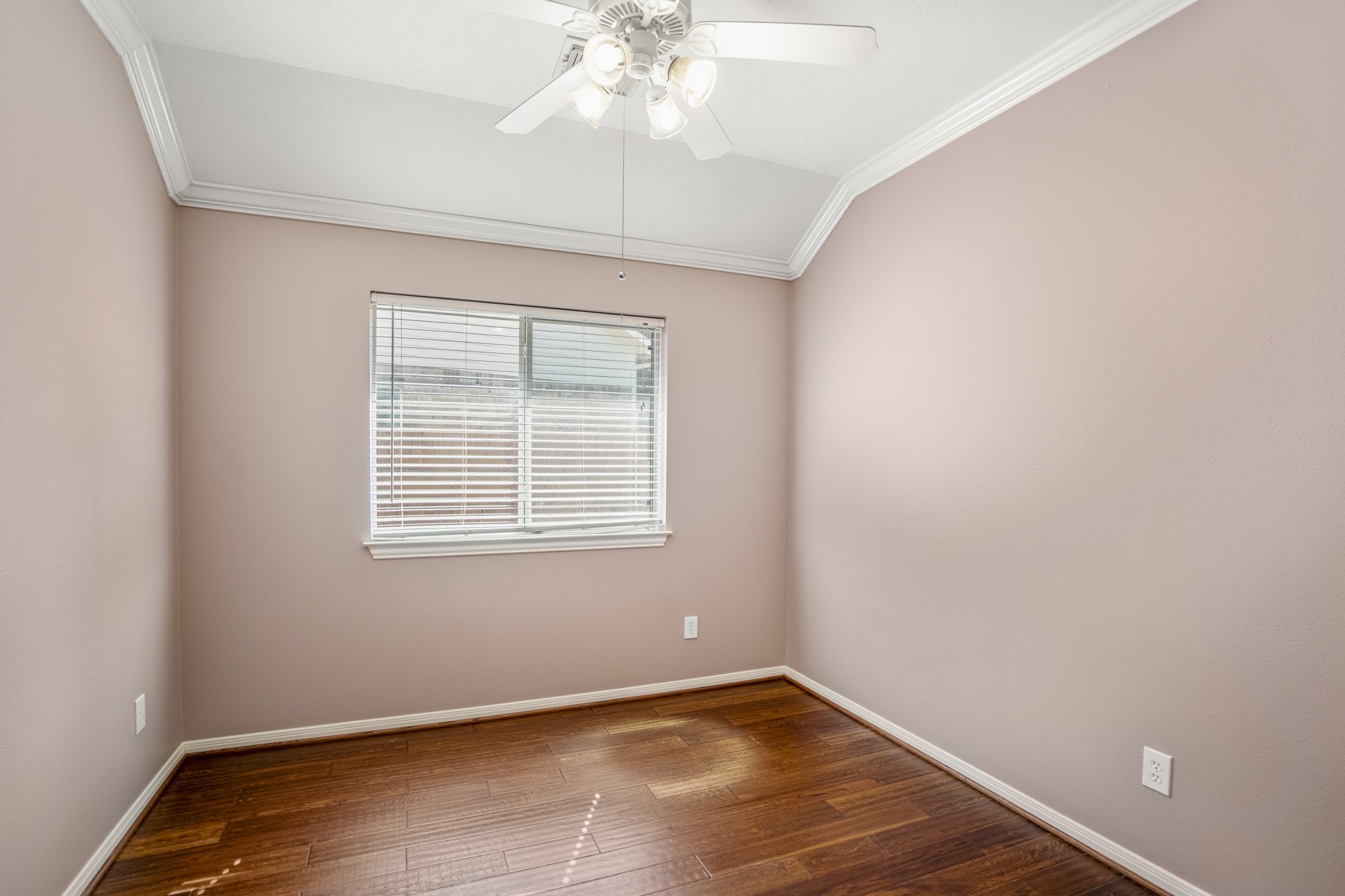 15 Heron Hollow Court Spring, TX 77382 - Photo 31 of 42 an empty room with wooden floor and windows