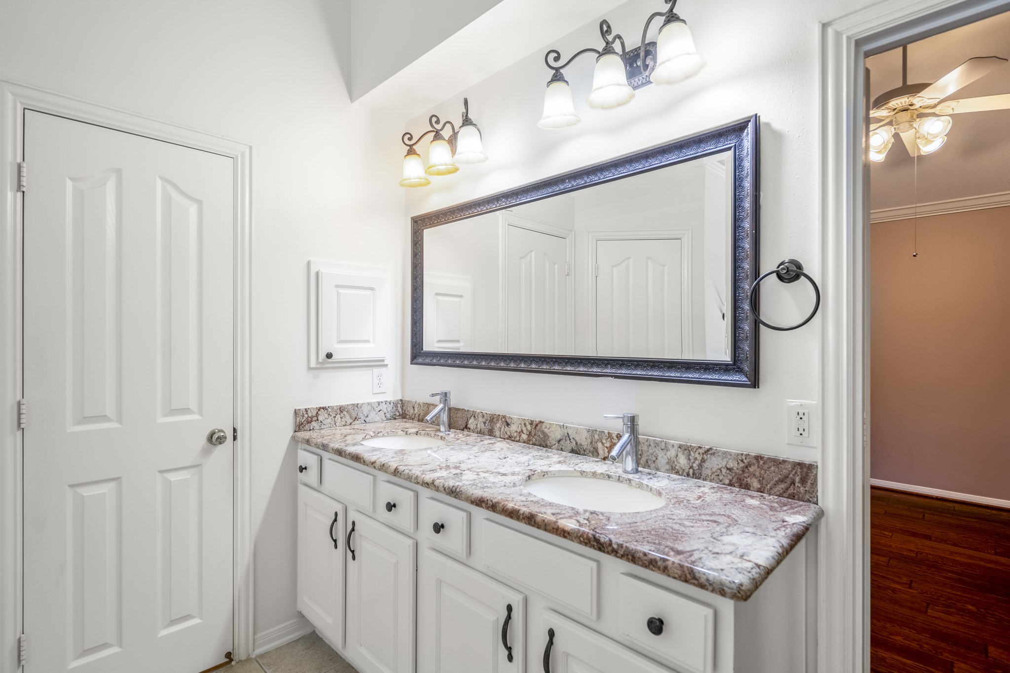 15 Heron Hollow Court Spring, TX 77382 - Photo 33 of 42 a bathroom with a granite countertop sink and a mirror