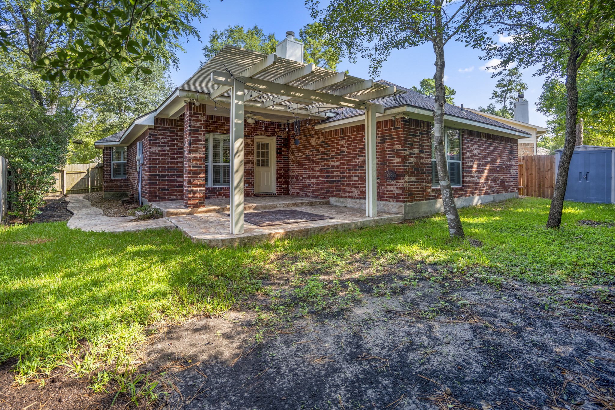 15 Heron Hollow Court Spring, TX 77382 - Photo 41 of 42 a view of a house with backyard and a tree