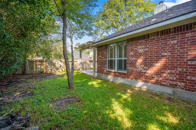 a backyard of a house with lots of green space