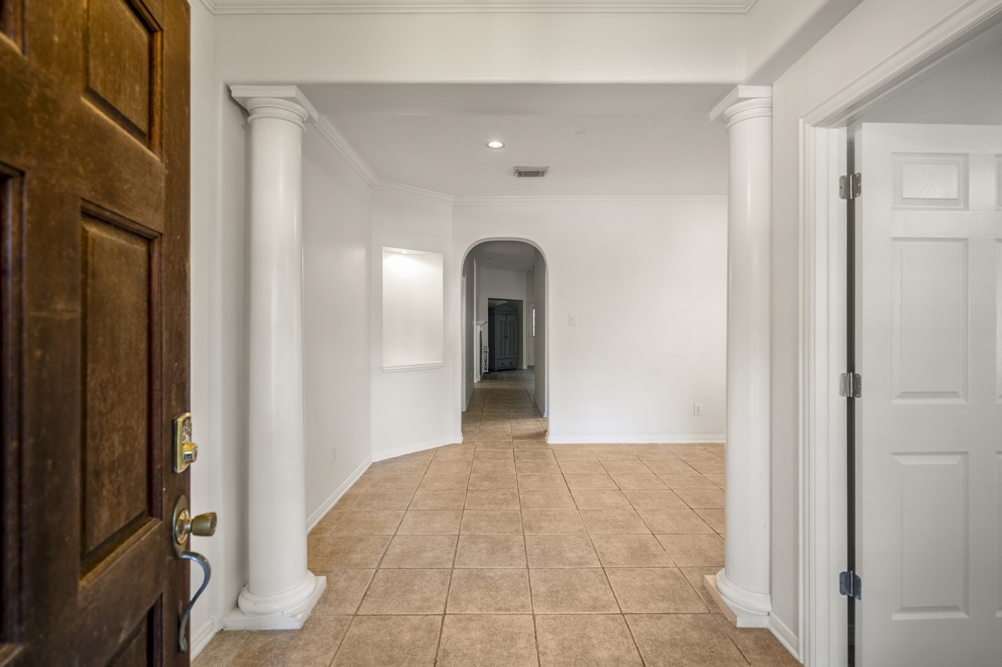 15 Heron Hollow Court Spring, TX 77382 - Photo 5 of 42 a view of a hallway to an empty room