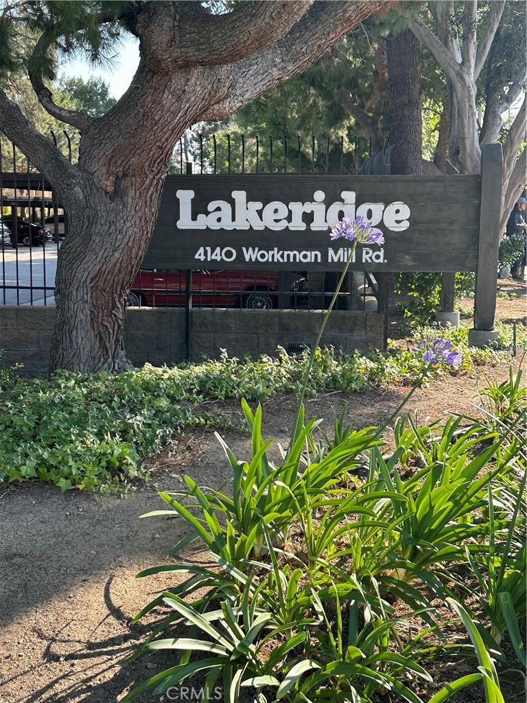 a sign that is in front of flowers