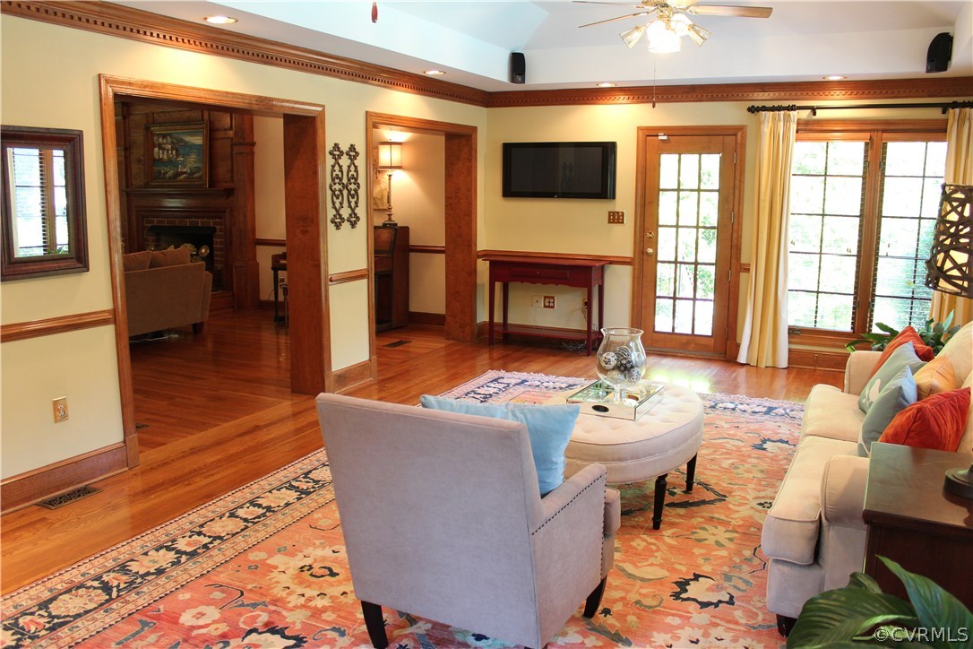 207 Rivers Bend Circle Chester, VA 23836 - Photo 12 of 36 a living room with fireplace furniture and a flat screen tv