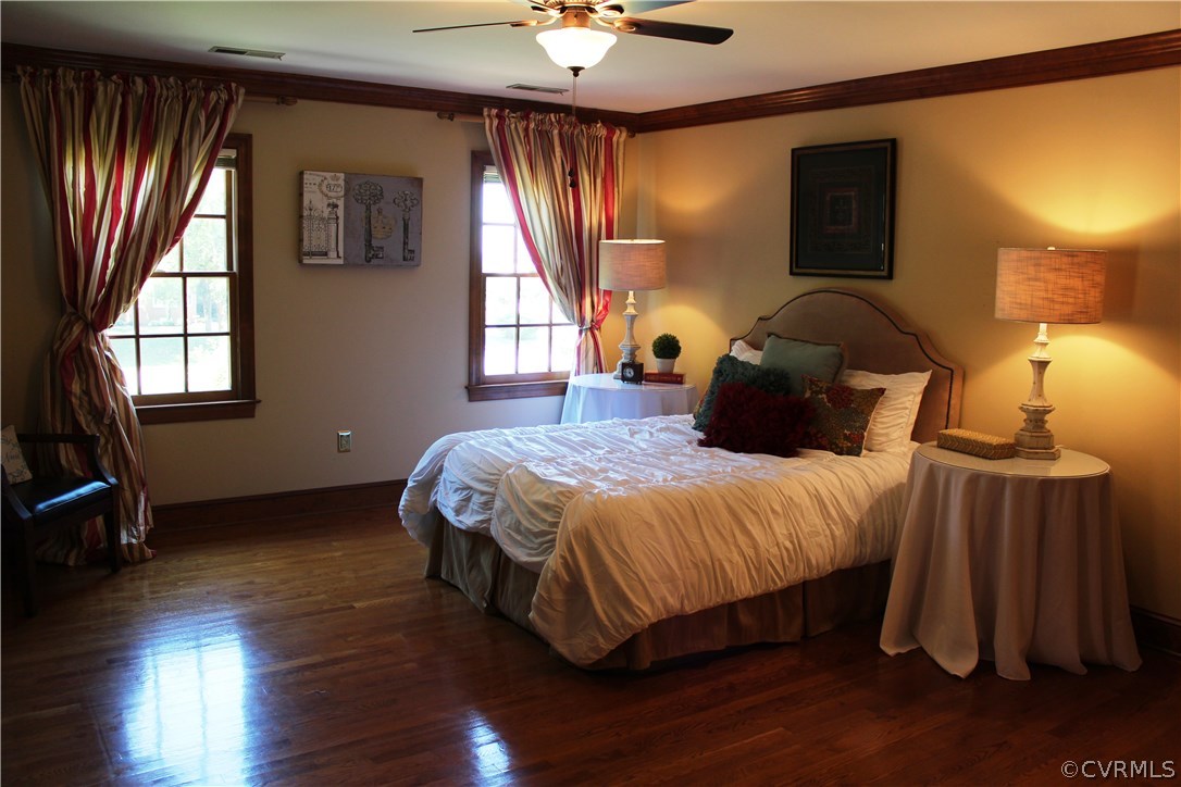 207 Rivers Bend Circle Chester, VA 23836 - Photo 15 of 36 a bedroom with a bed lamps and window