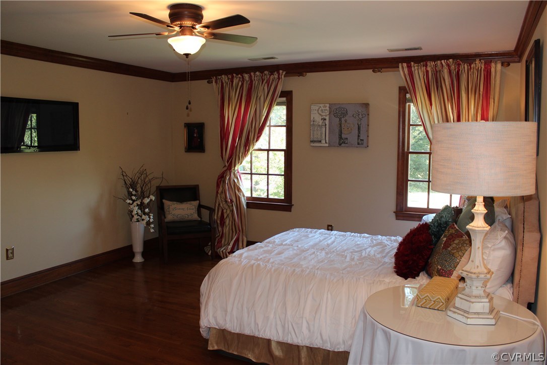 207 Rivers Bend Circle Chester, VA 23836 - Photo 16 of 36 a bedroom with a bed and a chandelier