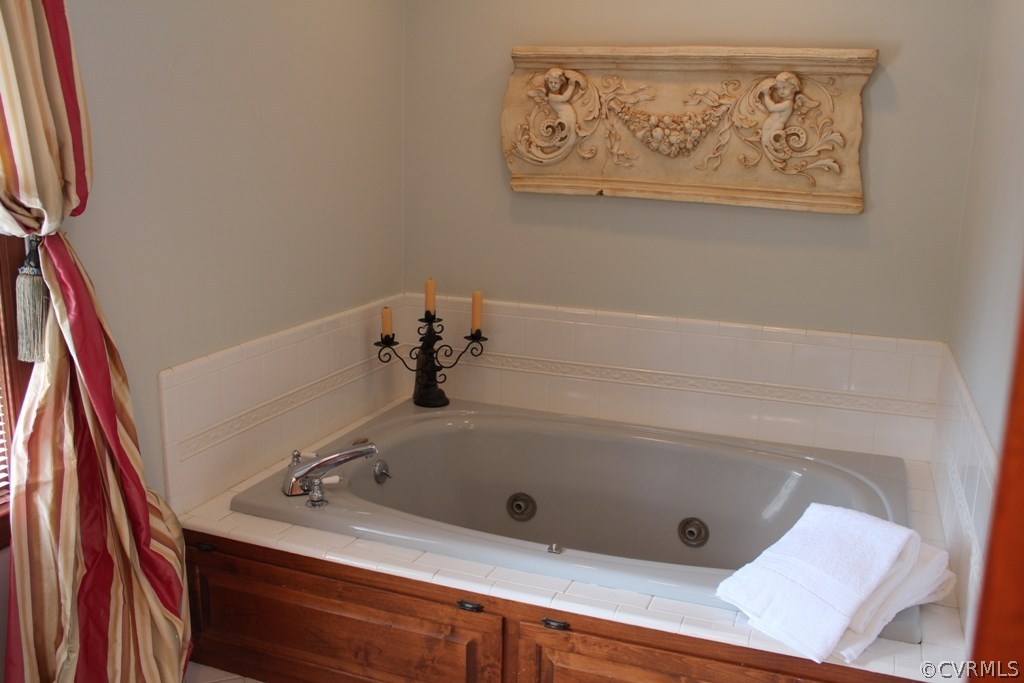 207 Rivers Bend Circle Chester, VA 23836 - Photo 17 of 36 a bathroom with a tub and sink