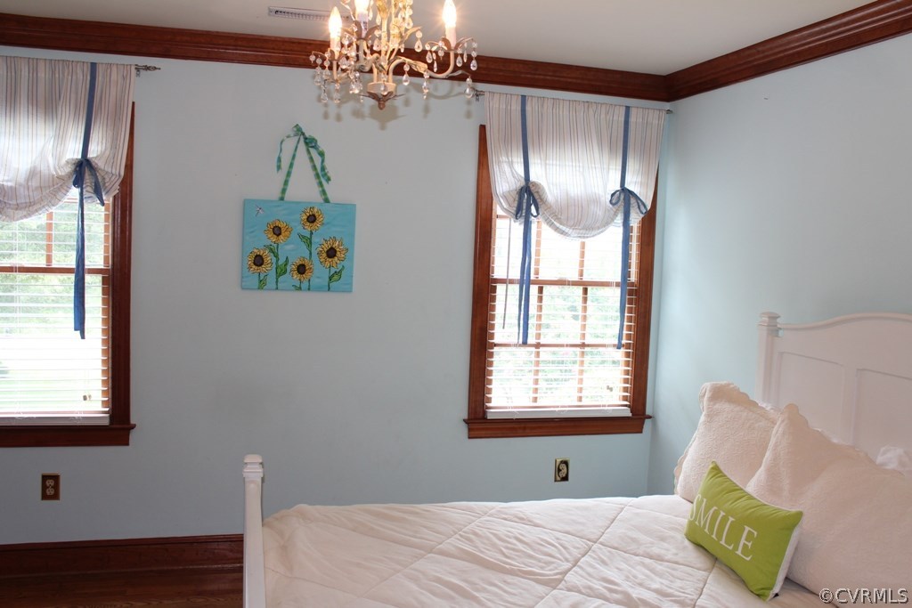 207 Rivers Bend Circle Chester, VA 23836 - Photo 19 of 36 a bedroom with furniture and a window