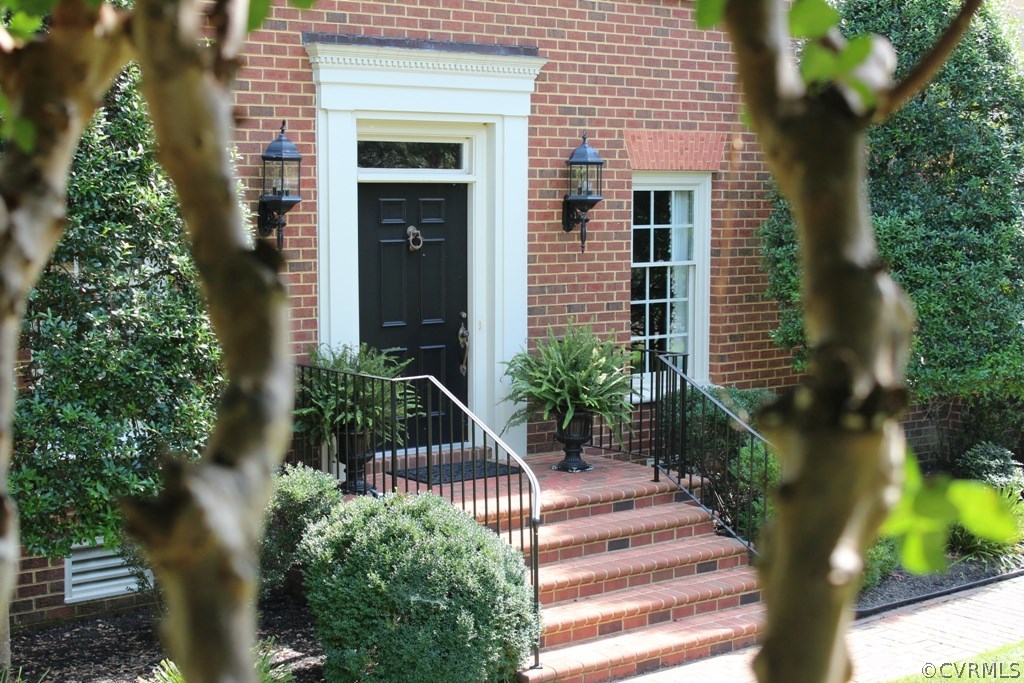 207 Rivers Bend Circle Chester, VA 23836 - Photo 2 of 36 a front view of a house with a garden
