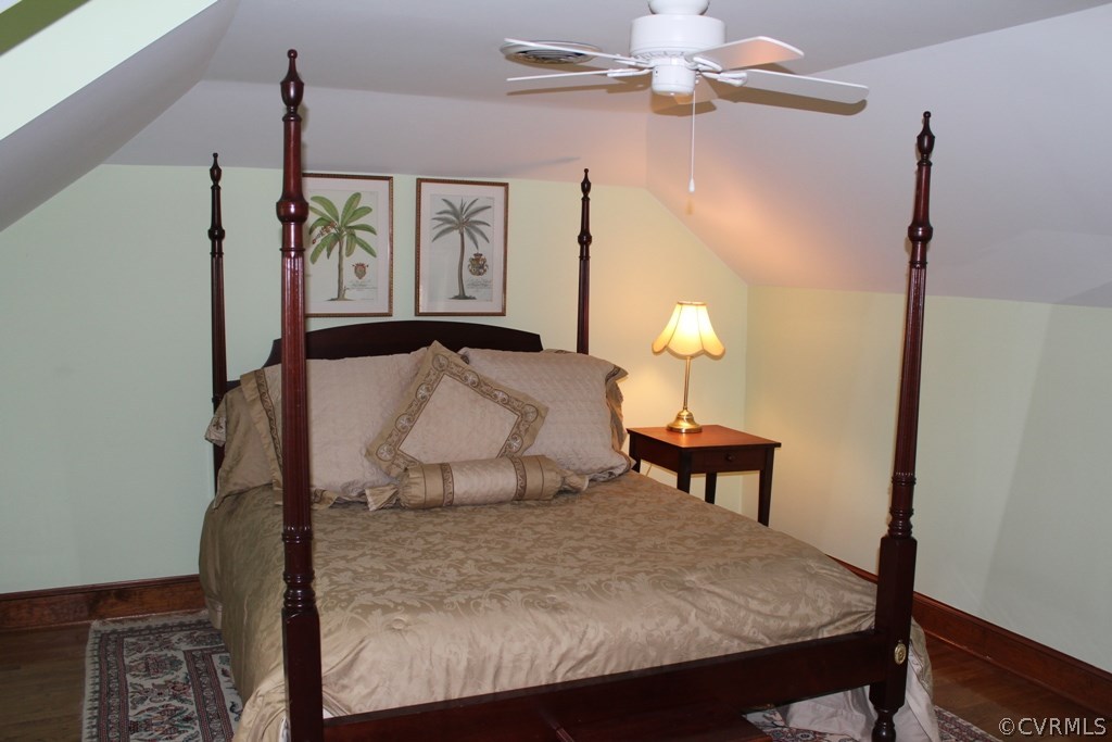 207 Rivers Bend Circle Chester, VA 23836 - Photo 21 of 36 a bedroom with a bed and a table