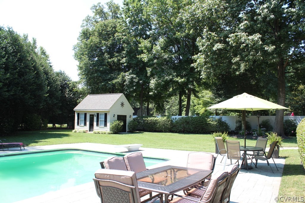 207 Rivers Bend Circle Chester, VA 23836 - Photo 31 of 36 a view of house with swimming pool yard fire pit and outdoor seating