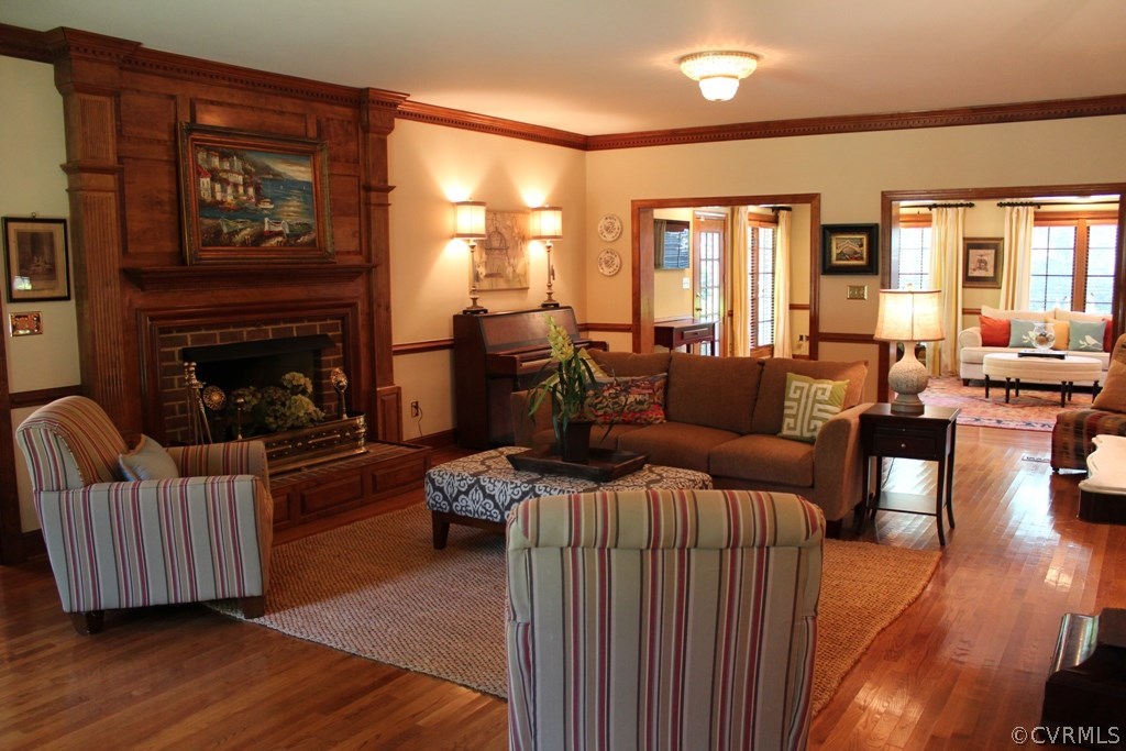 207 Rivers Bend Circle Chester, VA 23836 - Photo 5 of 36 a living room with furniture wooden floor and a fireplace
