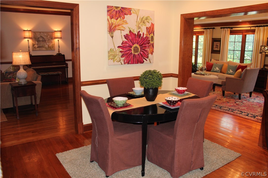 207 Rivers Bend Circle Chester, VA 23836 - Photo 9 of 36 a dining room with furniture and wooden floor
