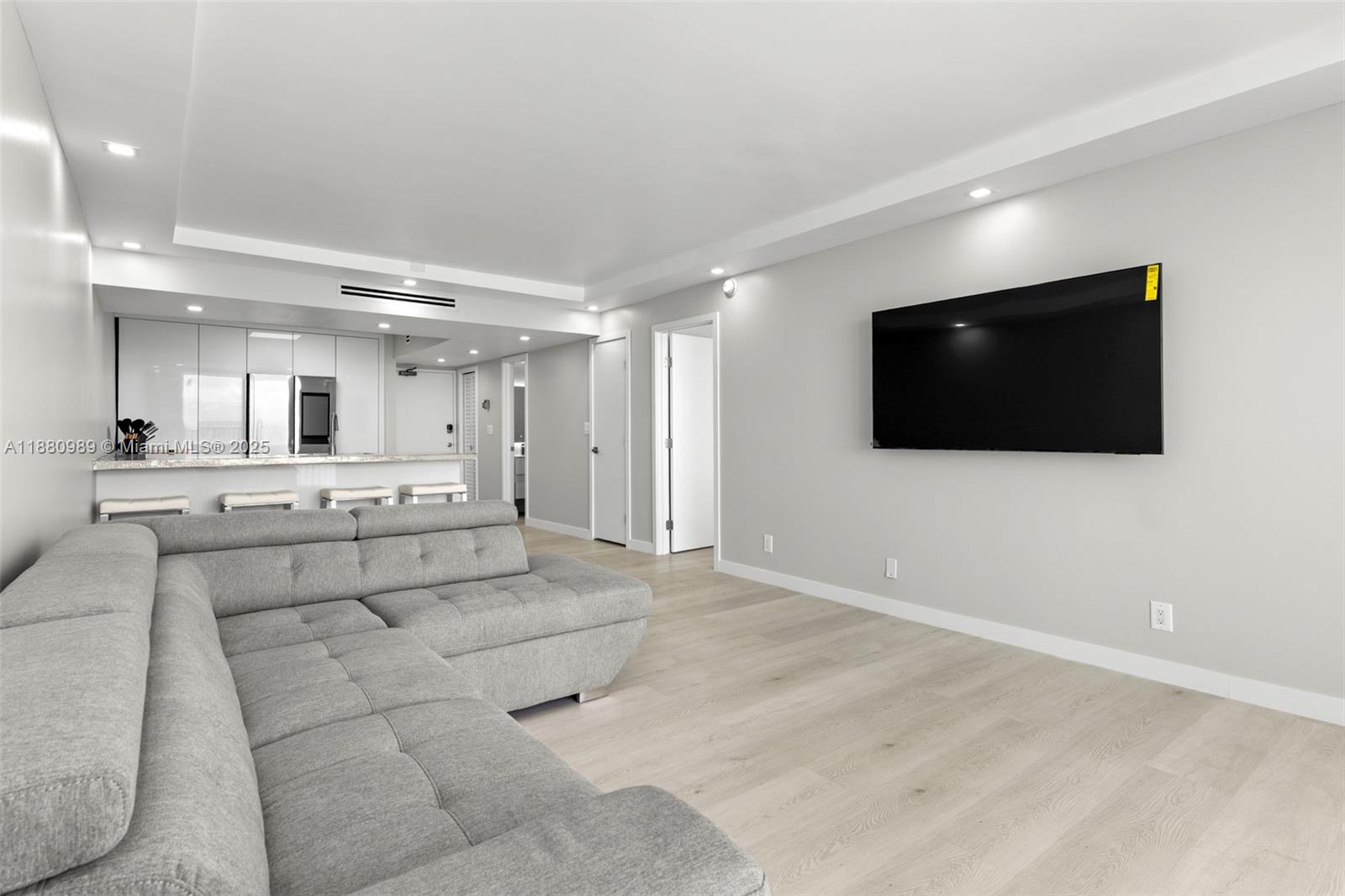 400 North Surf Road, Unit 903 Hollywood, FL 33019 - Photo 12 of 34 a view of a livingroom with furniture and flat screen tv
