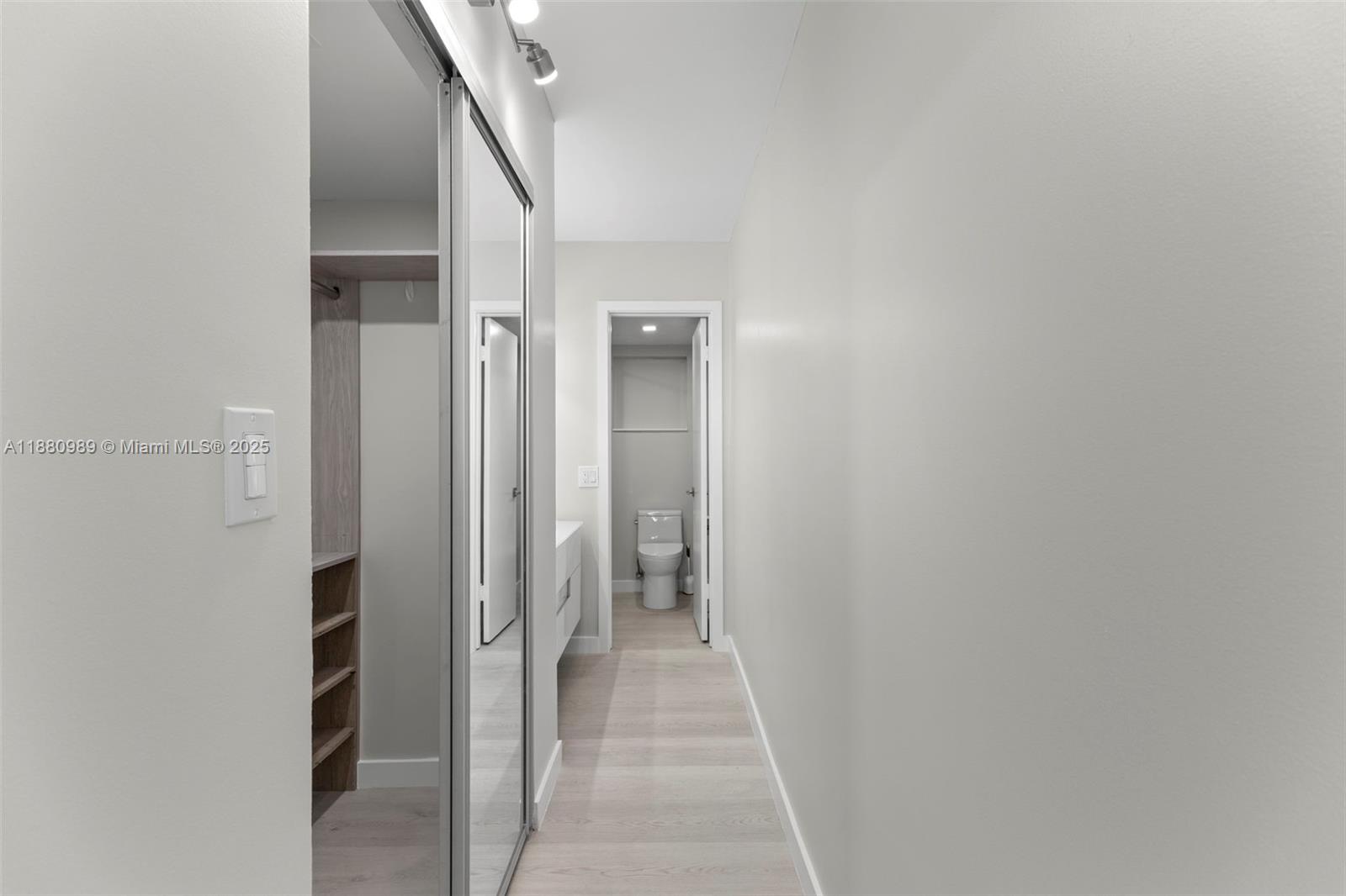 400 North Surf Road, Unit 903 Hollywood, FL 33019 - Photo 14 of 34 a view of a hallway with wooden shelves