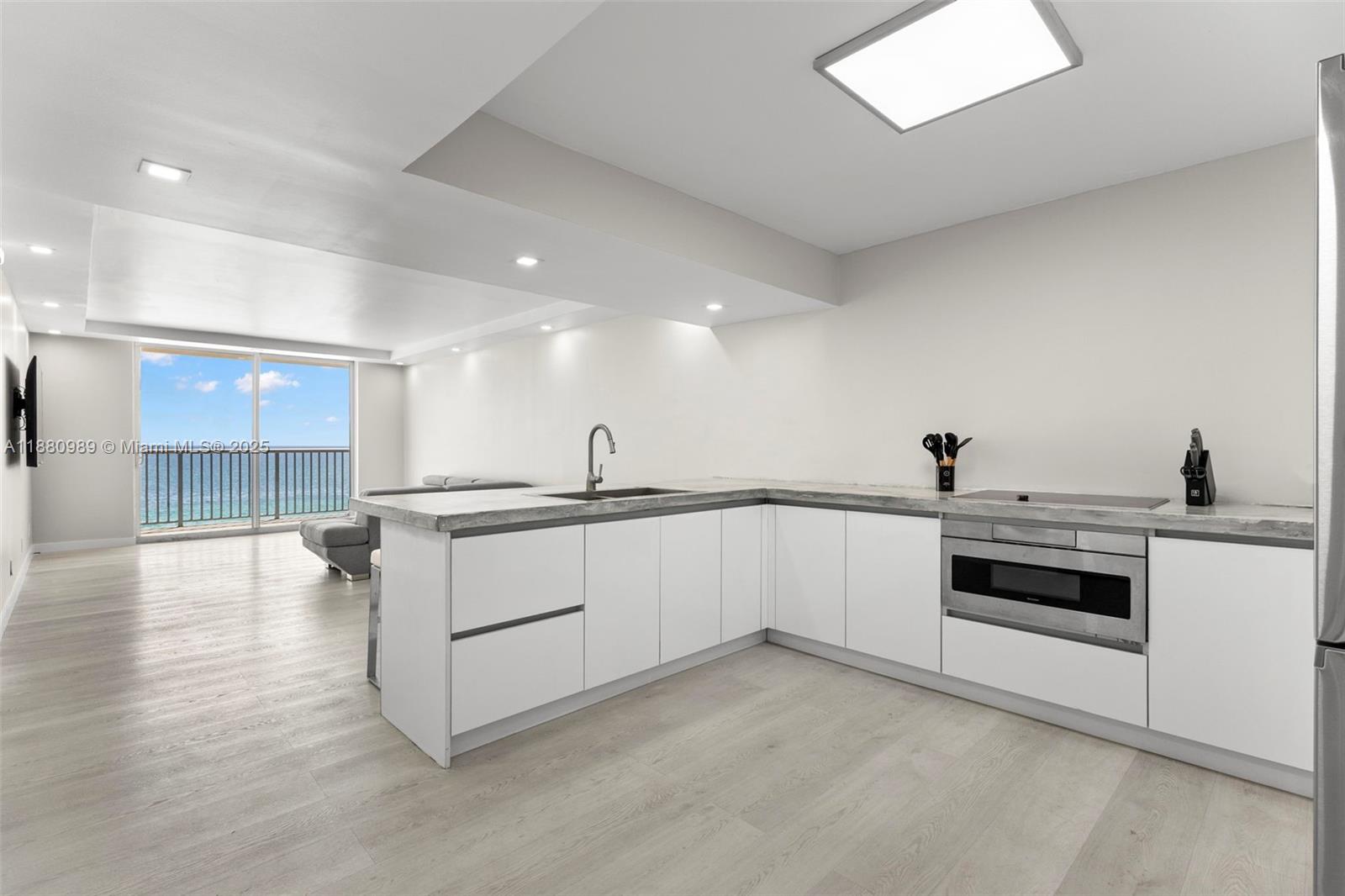 400 North Surf Road, Unit 903 Hollywood, FL 33019 - Photo 33 of 34 a view of a kitchen with sink and microwave