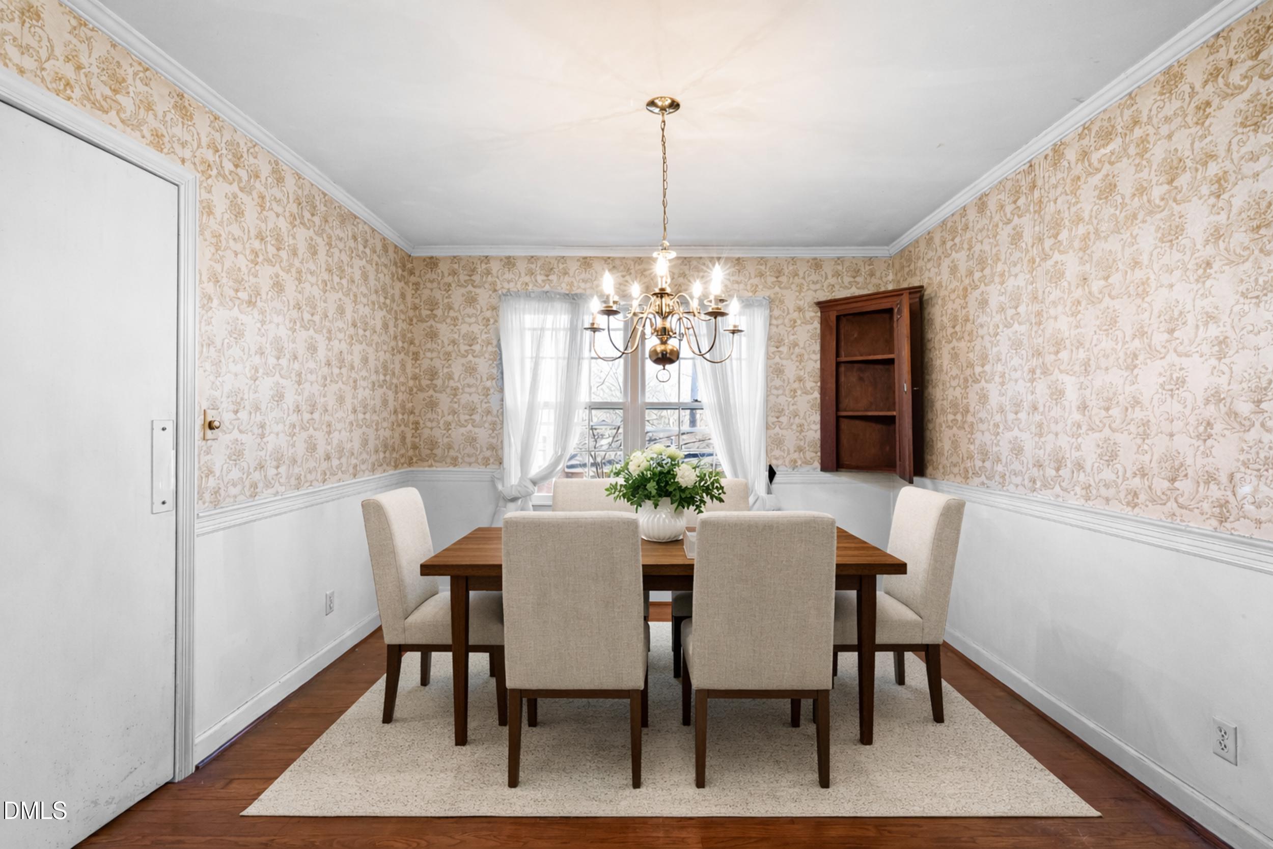 4208 Redington Drive Raleigh, NC 27609 - Photo 12 of 45 a view of a dining room with furniture window and wooden floor