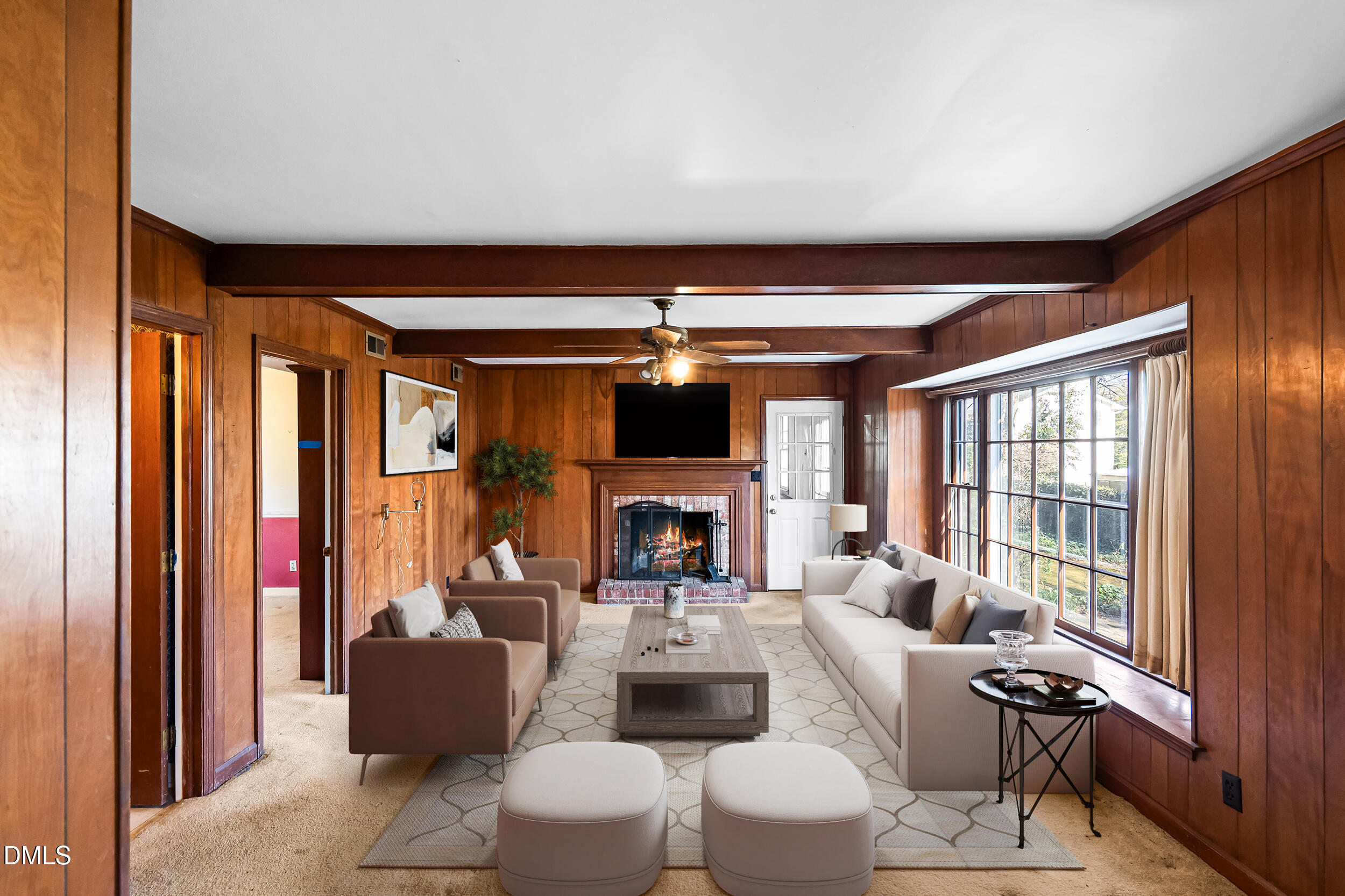 4208 Redington Drive Raleigh, NC 27609 - Photo 20 of 45 a living room with furniture a fireplace and a large window