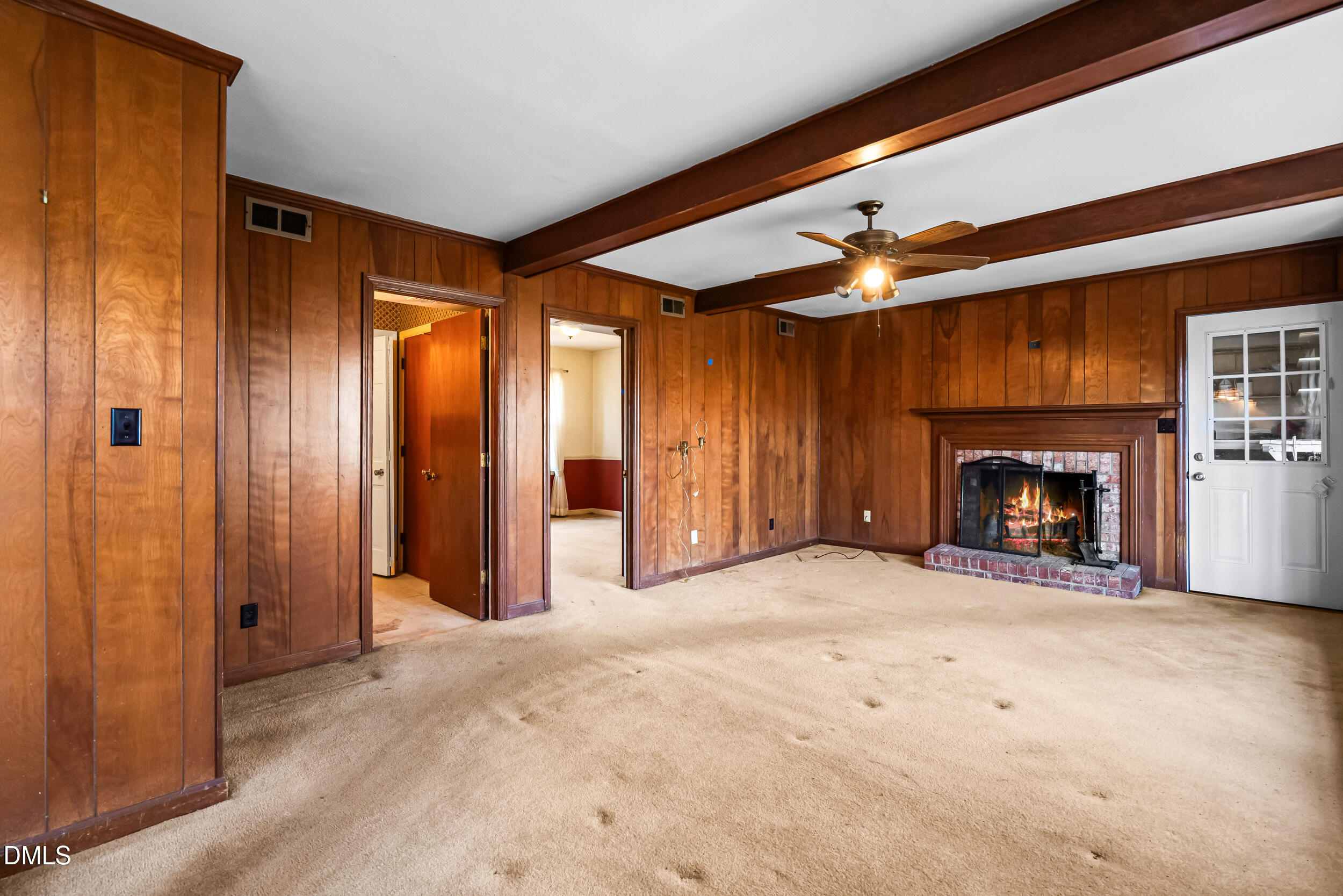 4208 Redington Drive Raleigh, NC 27609 - Photo 22 of 45 a view of an empty room with a fireplace