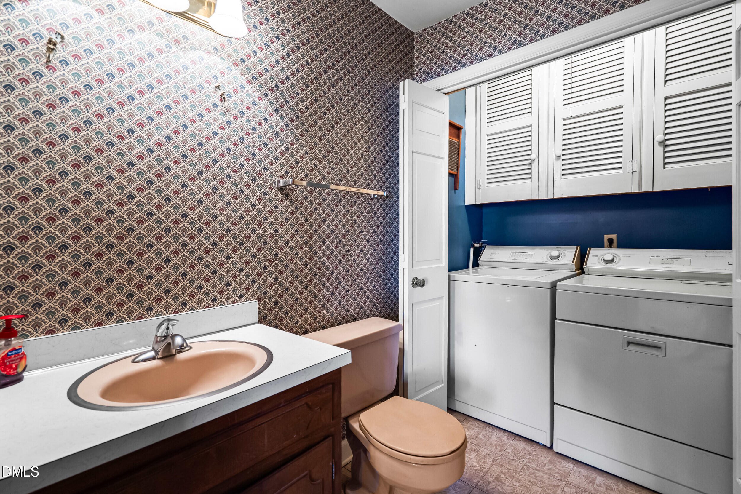 4208 Redington Drive Raleigh, NC 27609 - Photo 26 of 45 a bathroom with a sink a toilet and a mirror