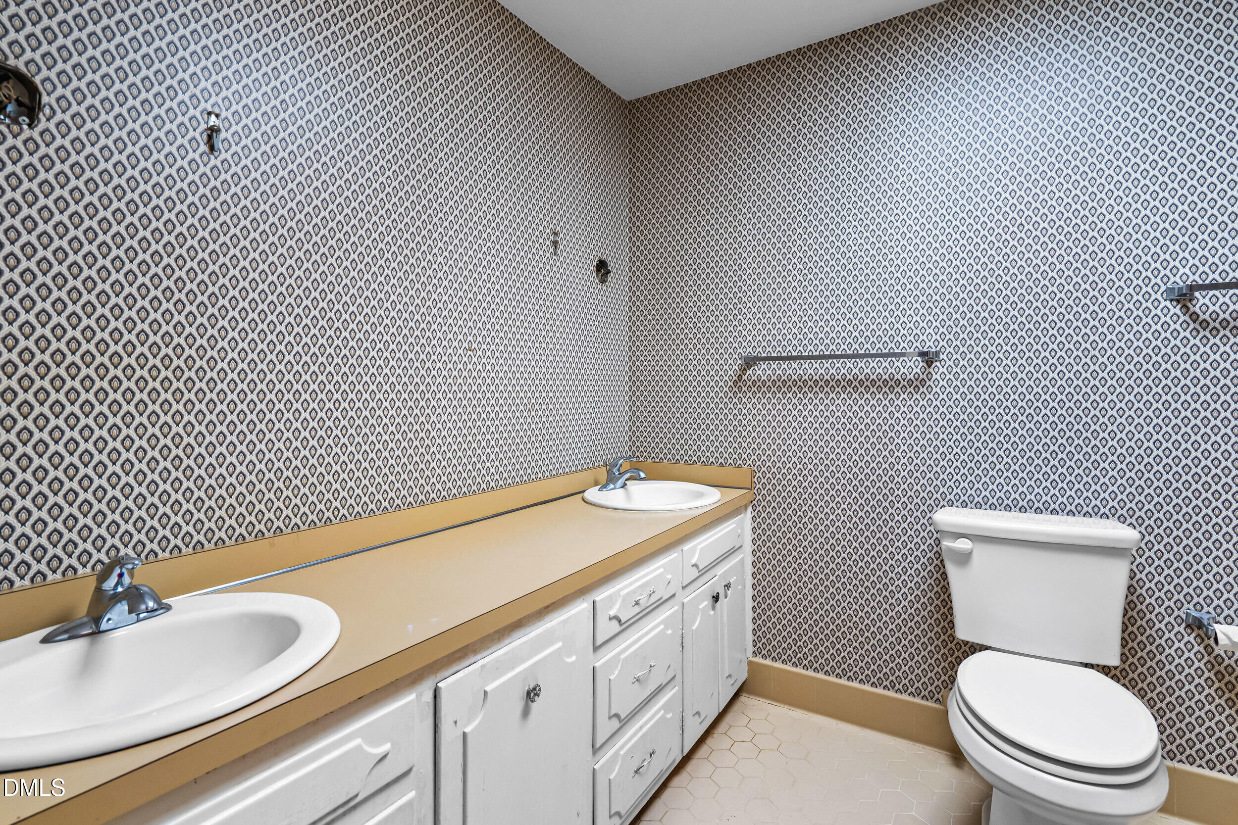 4208 Redington Drive Raleigh, NC 27609 - Photo 27 of 45 a bathroom with a granite countertop toilet and a sink