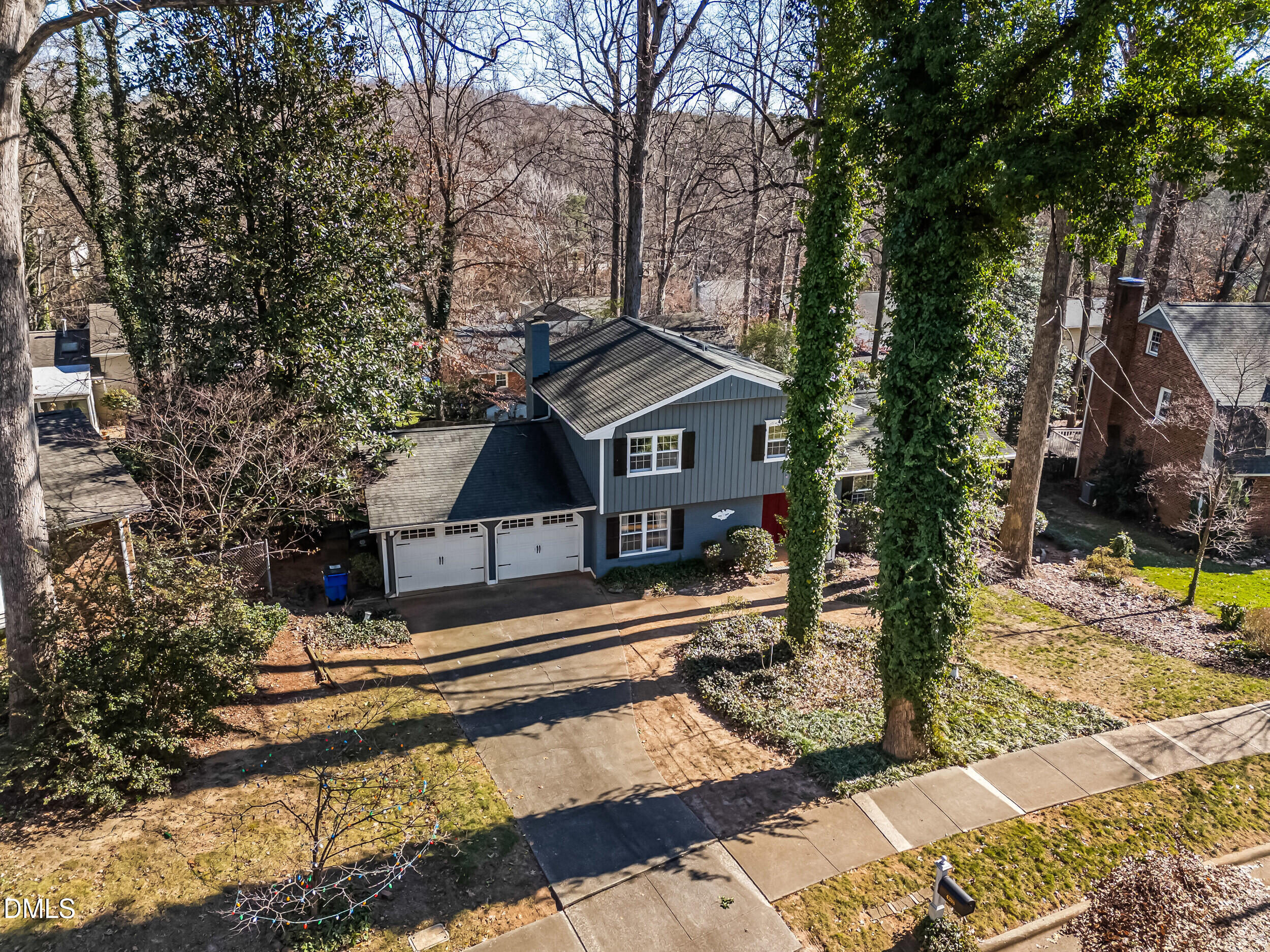 4208 Redington Drive Raleigh, NC 27609 - Photo 3 of 45 a front view of a house with a yard covered with snow in the background