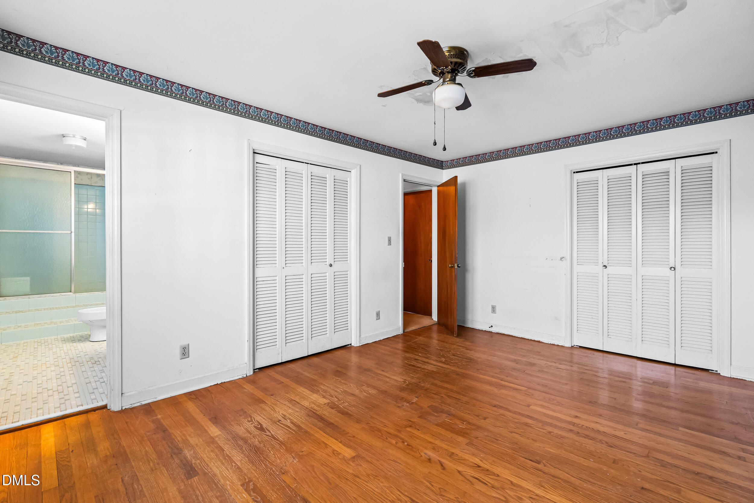 4208 Redington Drive Raleigh, NC 27609 - Photo 31 of 45 a view of empty room with wooden floor and ceiling fan