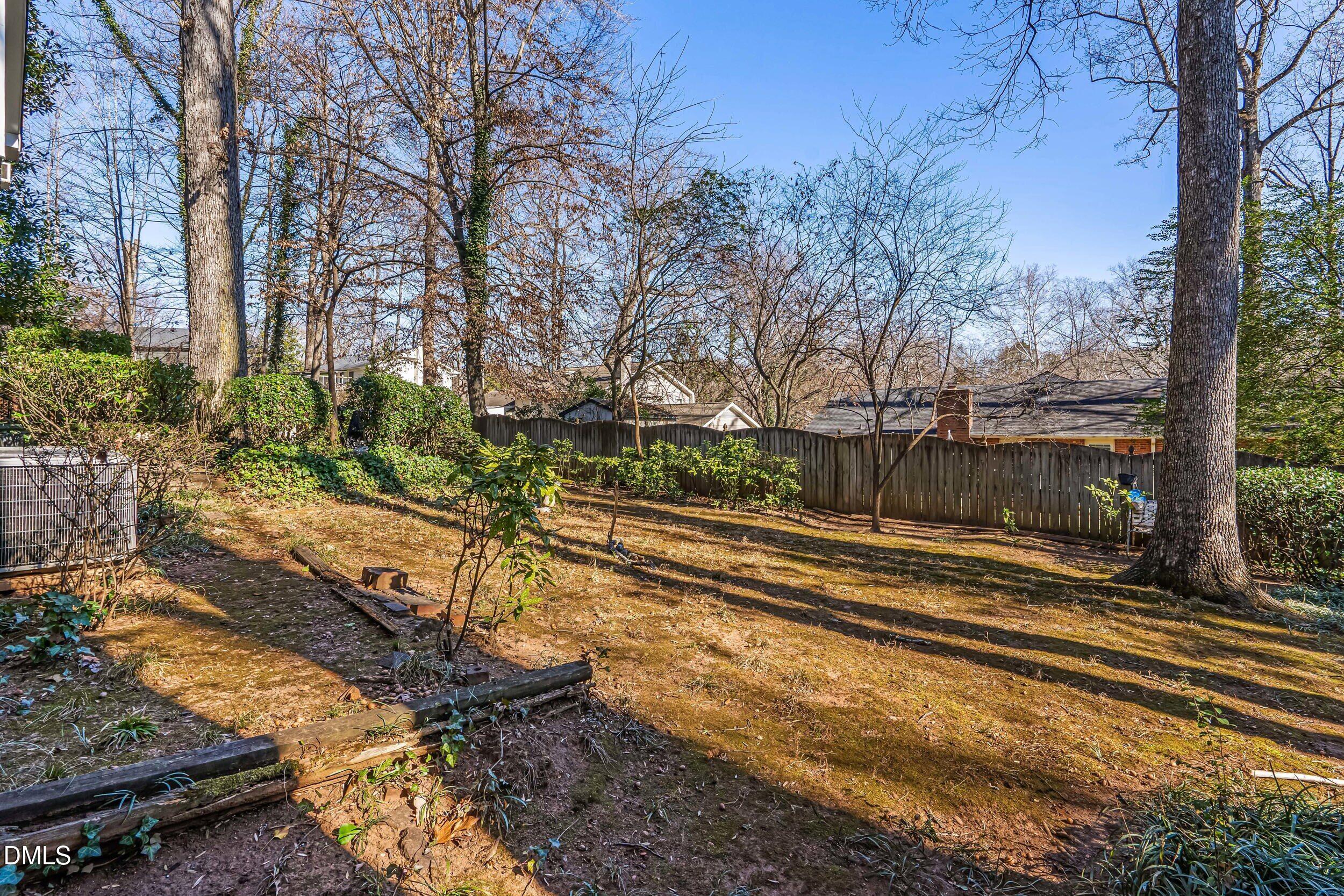 4208 Redington Drive Raleigh, NC 27609 - Photo 36 of 45 a view of a yard with large trees