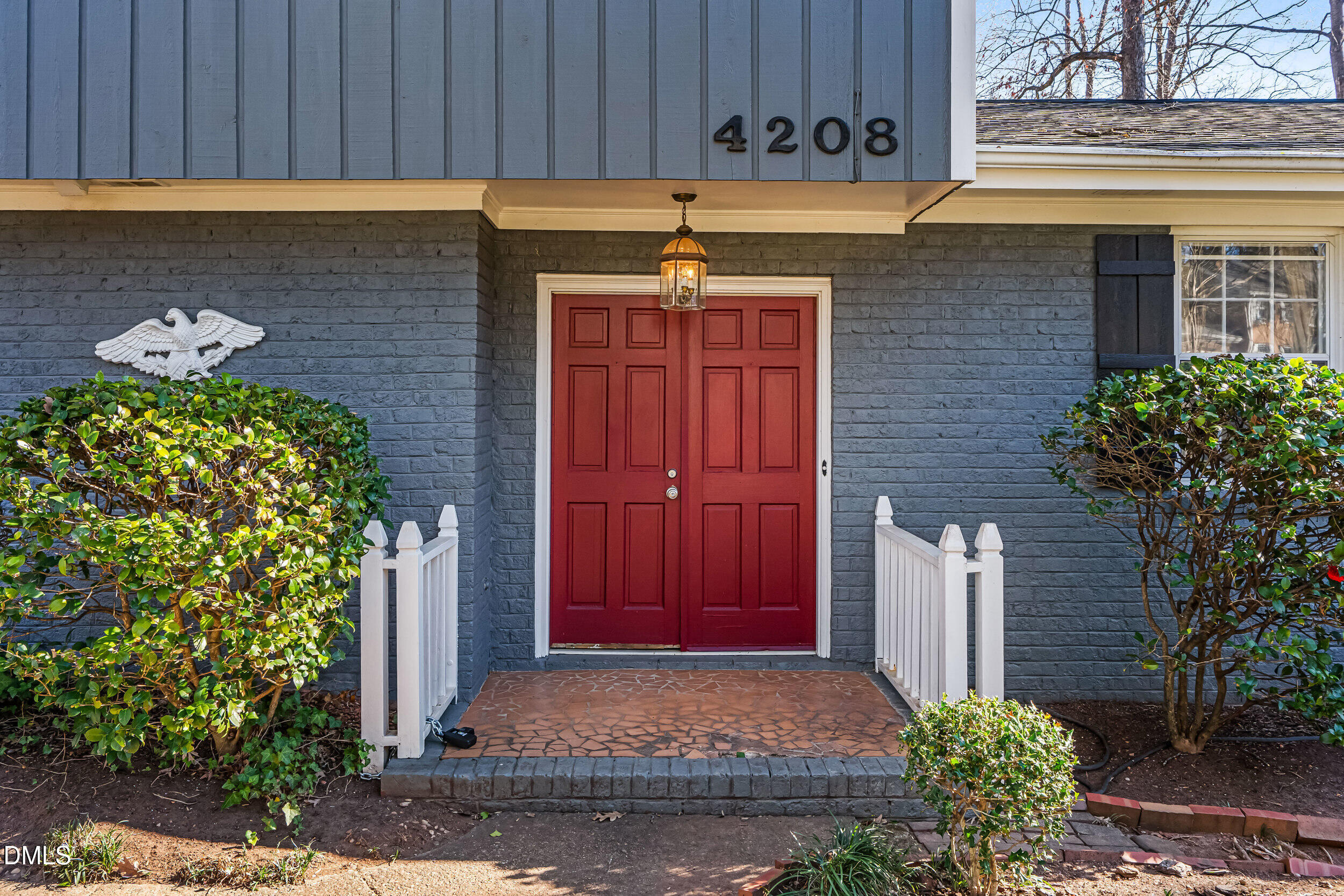 4208 Redington Drive Raleigh, NC 27609 - Photo 4 of 45 a front view of a house with a garden