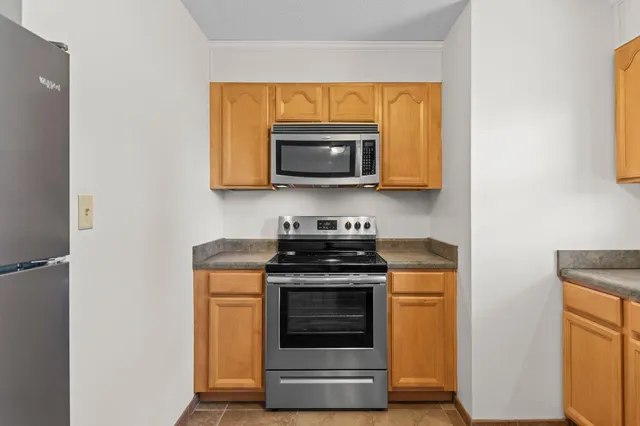 a kitchen with a stove and a microwave