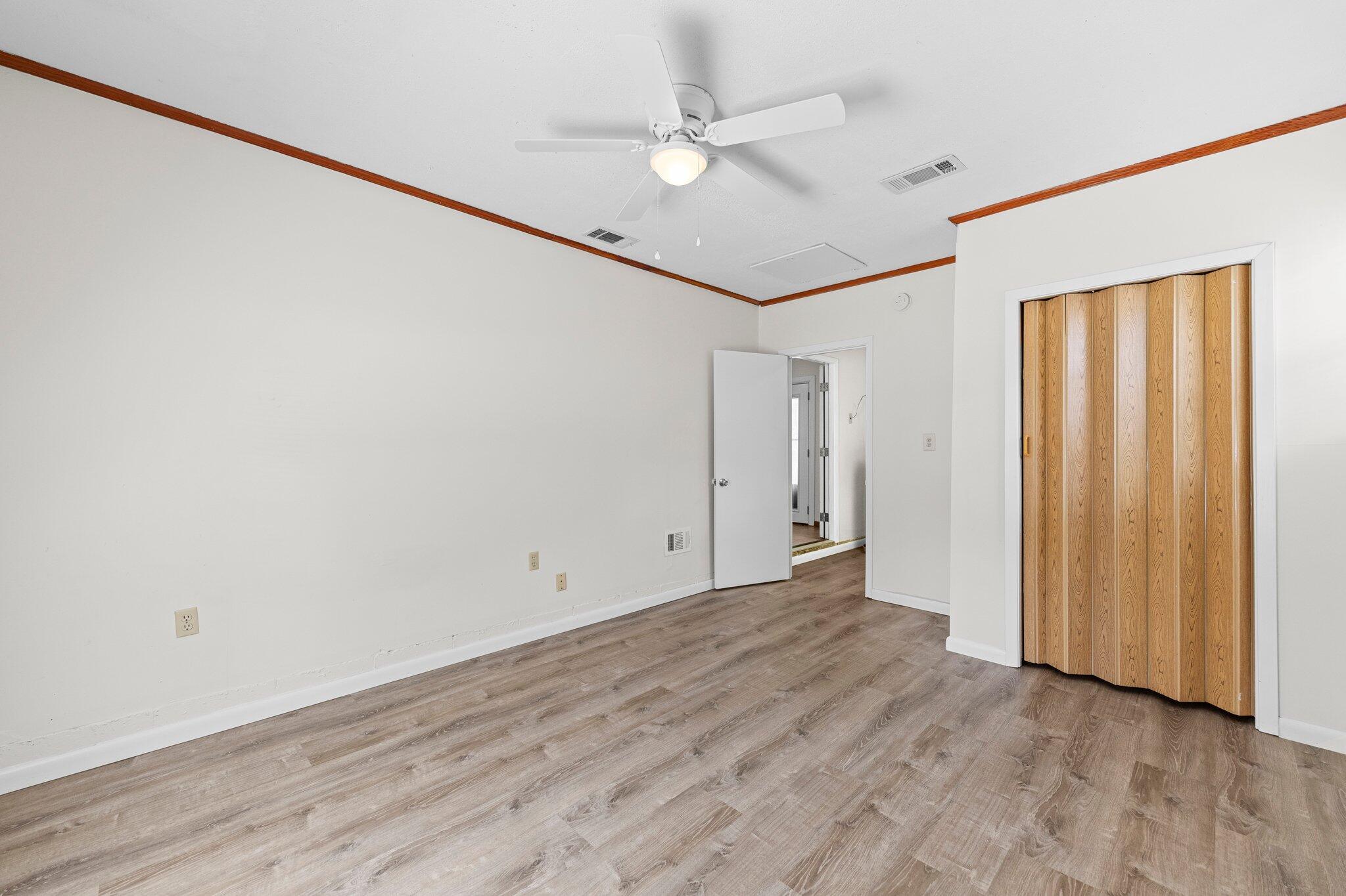 309 23rd Street Niceville, FL 32578 - Photo 20 of 33 wooden floor in an empty room